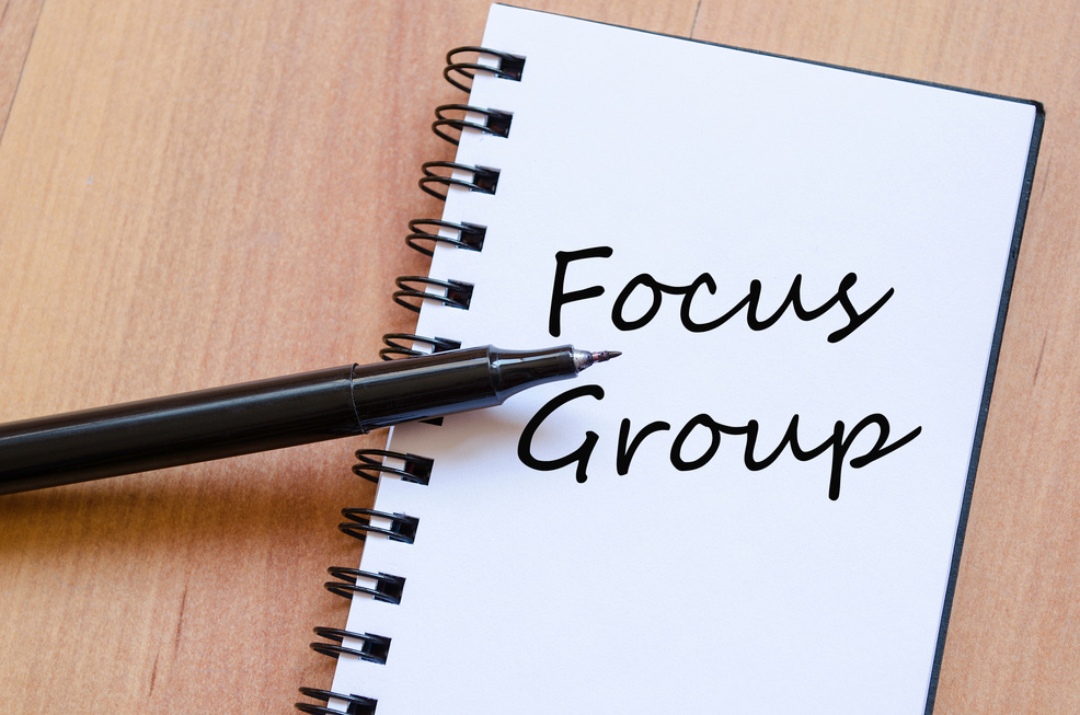 a notepad that says focus group